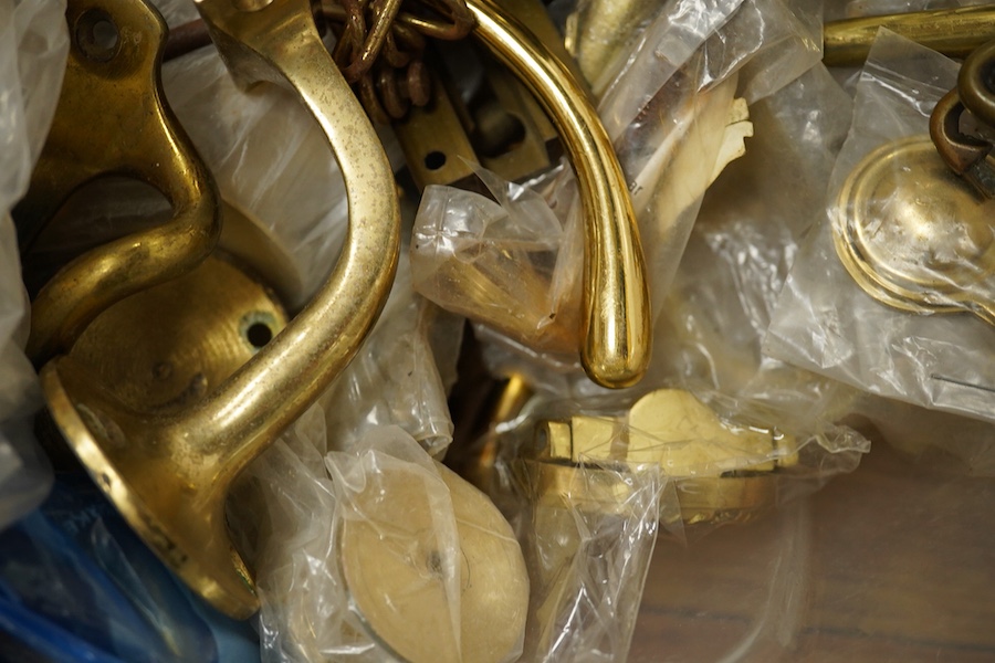 A collection of brass fittings to include lions-head door-knocker and various handles and hinges. Condition - varies